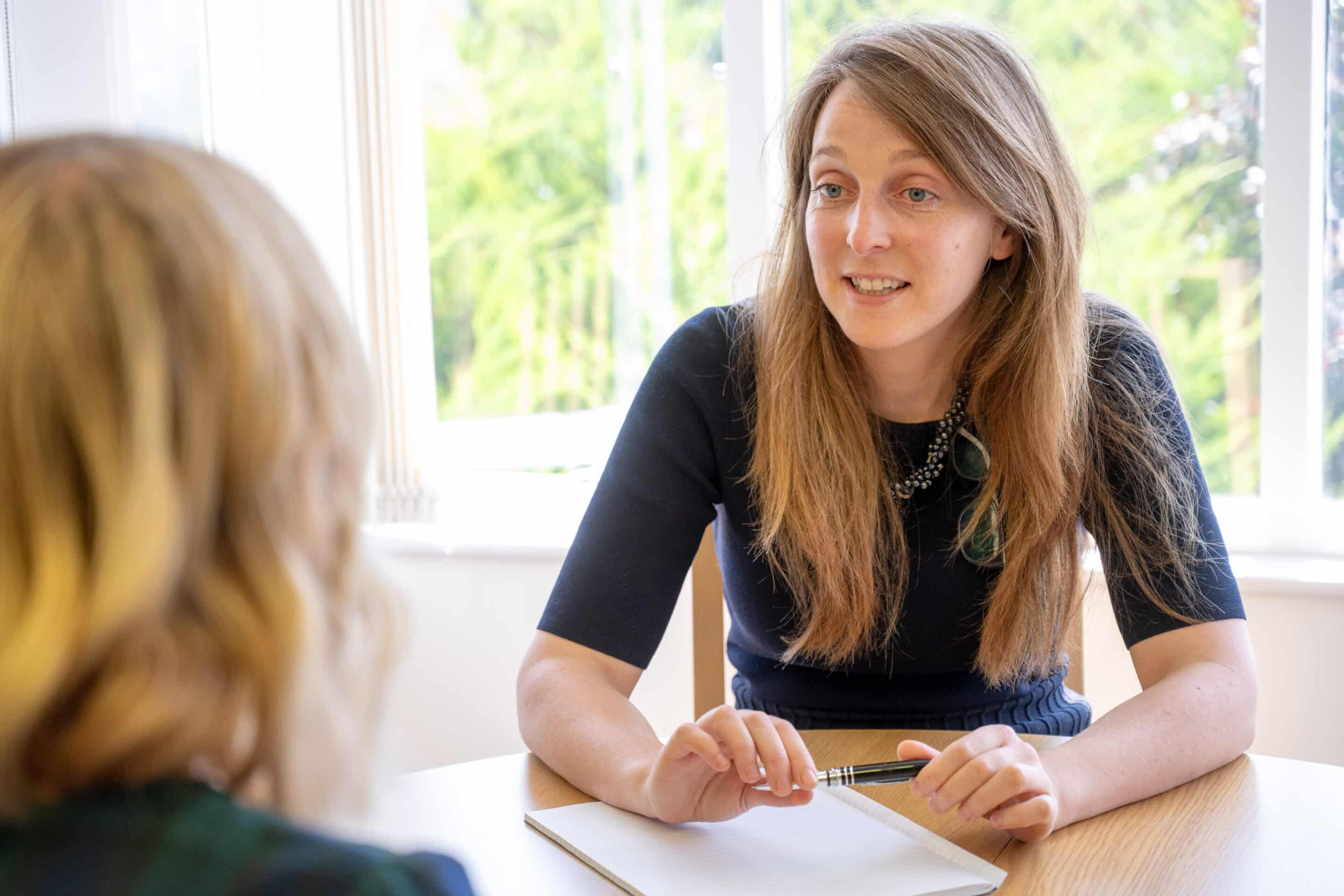 A solicitor at Paytons in Malvern talking with a client
